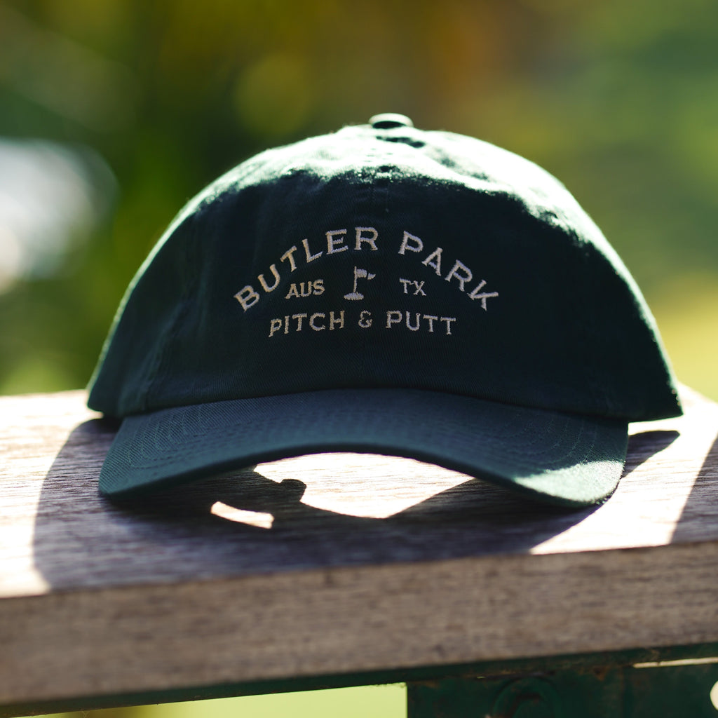 Butler Pitch and Putt's new Dad Hat in forest green.